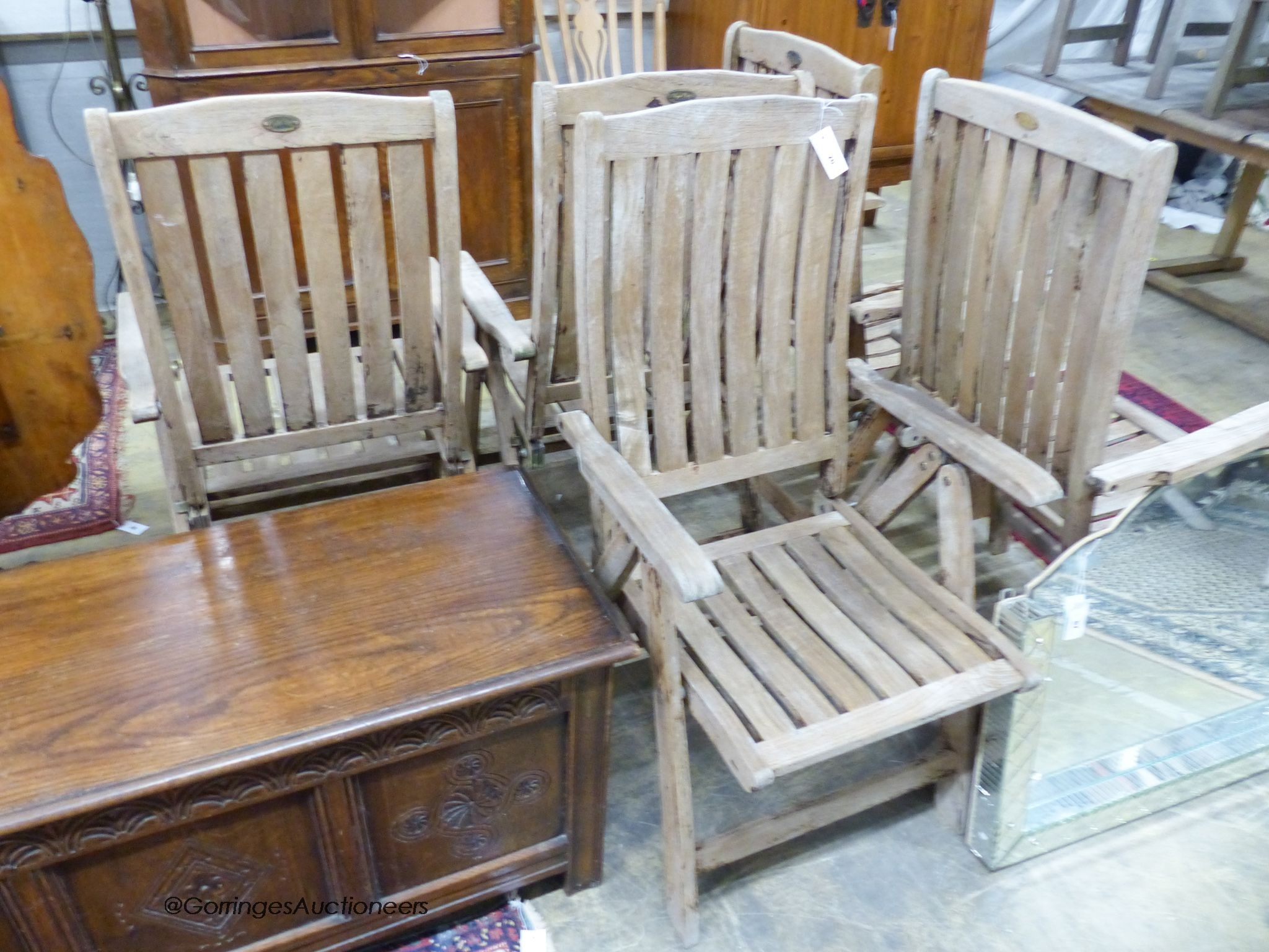Five weathered teak folding reclining garden armchairs